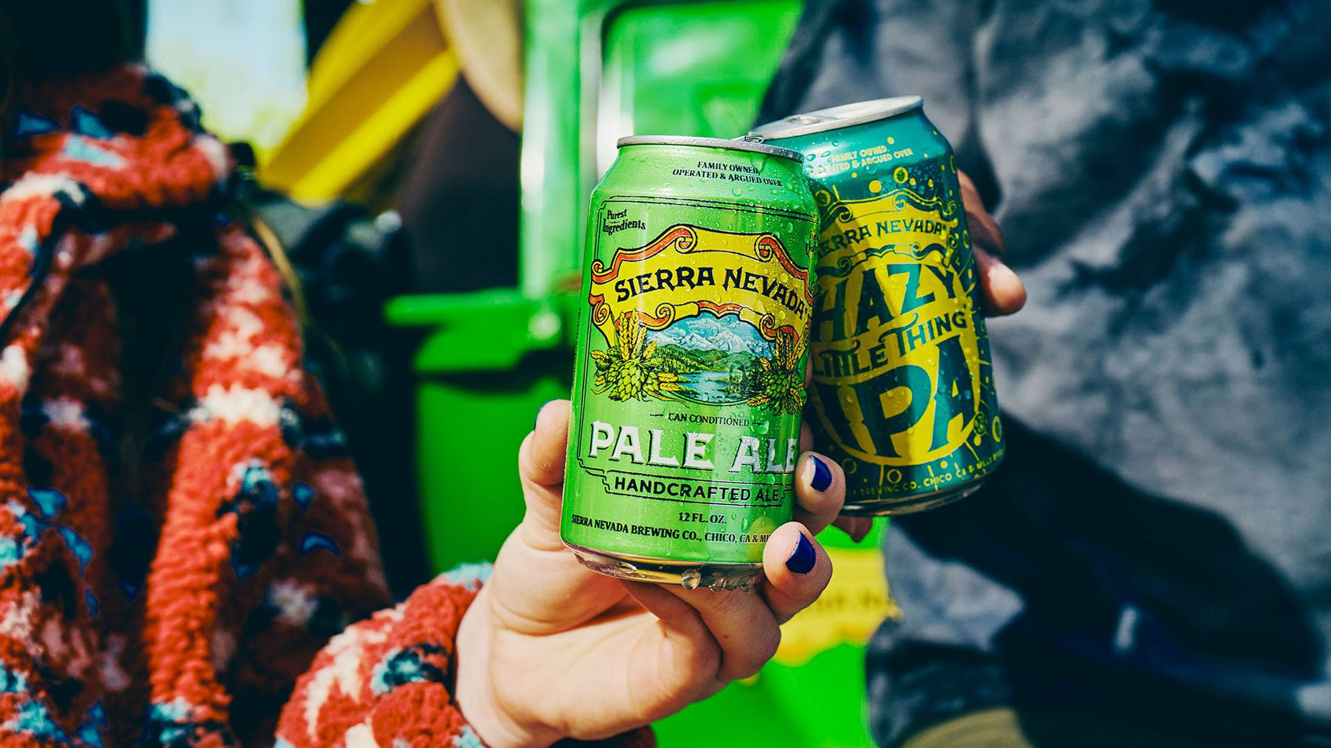 Two people cheer-sing with Sierra Nevada beer