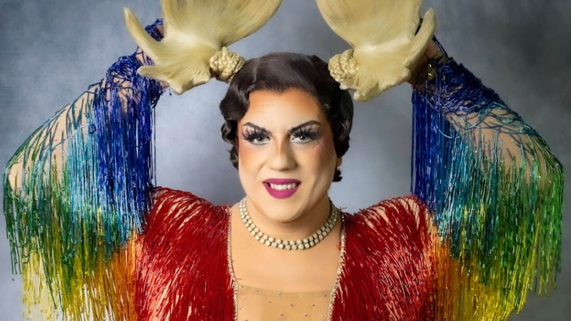 A Drag Bingo Queen ready to rock it with hair that looks like horns