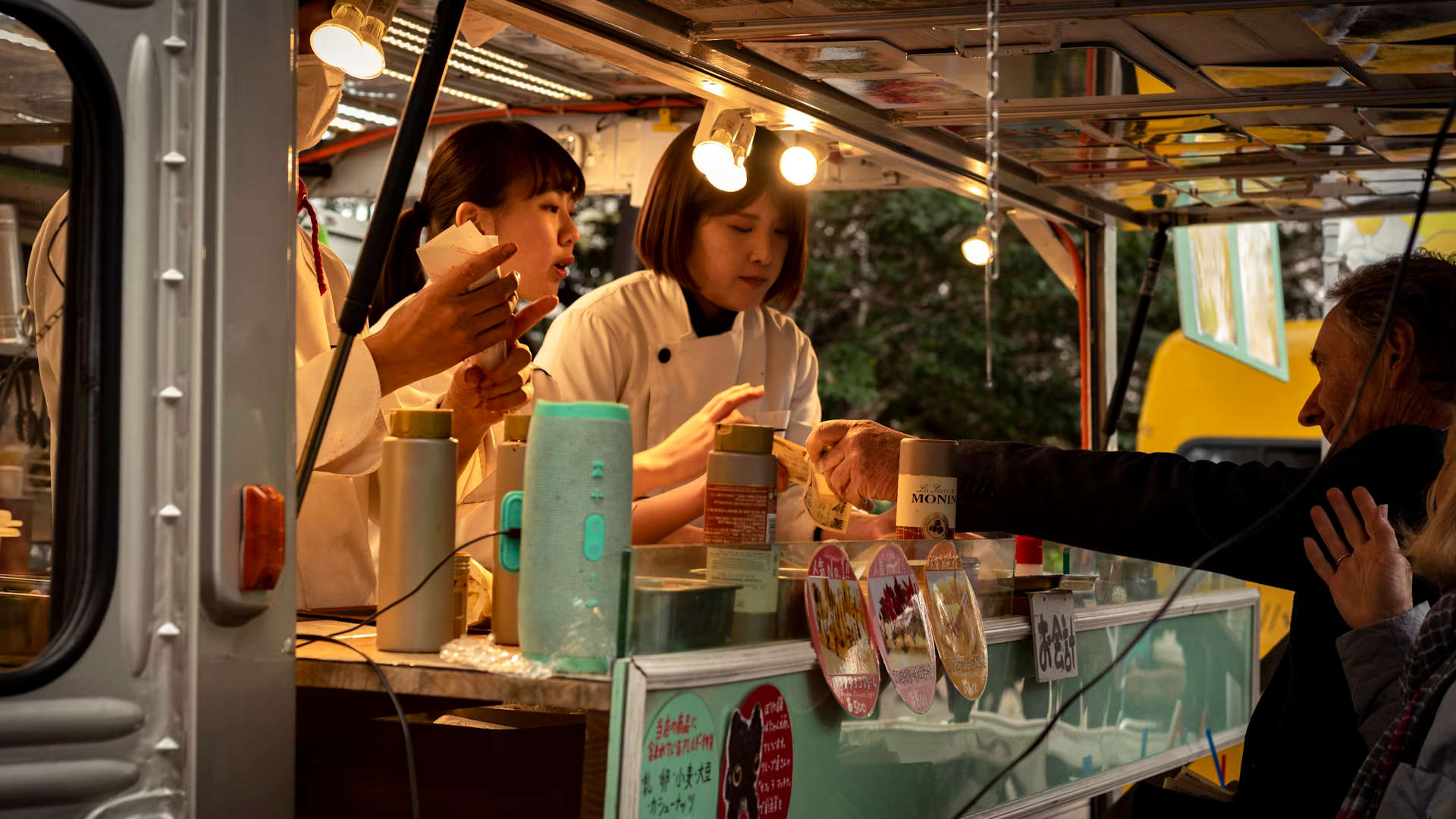 People paying at a food truck