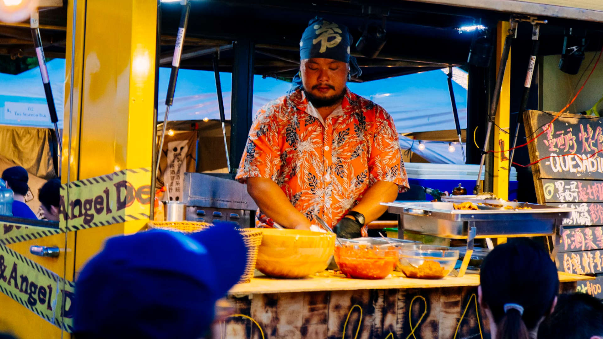 A man making food inside a food truck